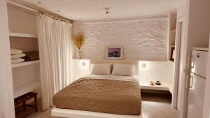 Postel nebo postele na pokoji v ubytování Mykonos Seaview Nests - Tourlos Getaways