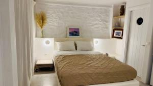Postel nebo postele na pokoji v ubytování Mykonos Seaview Nests - Tourlos Getaways