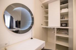 a bathroom with a mirror and a white sink at Studio Arco Rustic in Zagreb