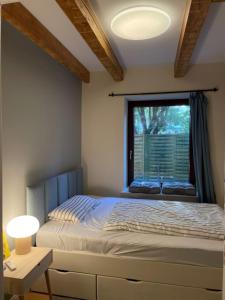 En eller flere senge i et værelse på Loft De Leevde
