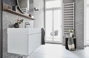 a kitchen with a white refrigerator in a room at Villa Esperance - Suite Céleste mit Balkon, Dampfbad Whg 10 in Binz
