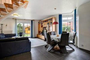 a living room with a table and a couch at Lizzy in Dornum