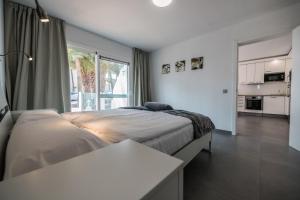 Posteľ alebo postele v izbe v ubytovaní Bahia Calma Beach