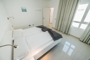 Posteľ alebo postele v izbe v ubytovaní Bahia Calma Beach