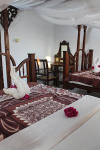 Postel nebo postele na pokoji v ubytování Garden Lodge