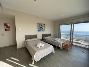 Postel nebo postele na pokoji v ubytování Apartamentos Entremares - Grupo Antonio Perles