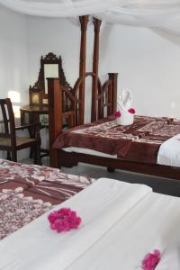 Postel nebo postele na pokoji v ubytování Garden Lodge