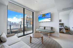 a living room with a couch and a large window at New unit 28th Floor with Unbeatable Bayside Views in Miami