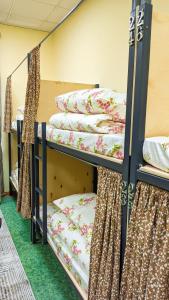 Postel nebo postele na pokoji v ubytování Sun Hostel