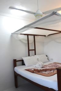 Postel nebo postele na pokoji v ubytování Garden Lodge