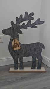 a metal sculpture of a reindeer on a table at Haus Ilse Wohnung 9 in Sankt Andreasberg