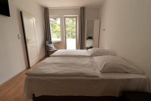 Postel nebo postele na pokoji v ubytování Hotel Eilenriede