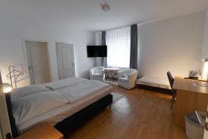 Postel nebo postele na pokoji v ubytování Hotel Eilenriede + 4 fotografie
