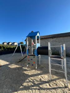 a playground with a cannon and a slide at Osada Chańcza in Chańcza +27 photos