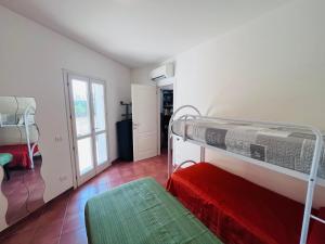Ένα ή περισσότερα κρεβάτια σε δωμάτιο στο Casa Solana al Cavo - Elba Affitti