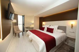 Posteľ alebo postele v izbe v ubytovaní Hotel Cardenal