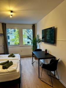 Ένα ή περισσότερα κρεβάτια σε δωμάτιο στο Larooms One