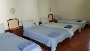 En eller flere senger på et rom på Pai Klang Vieng