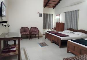 Postel nebo postele na pokoji v ubytování Prashanth Family Homestay