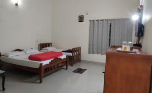 Postel nebo postele na pokoji v ubytování Prashanth Family Homestay