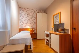 Postel nebo postele na pokoji v ubytování Hotel Velus