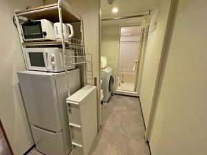 Kuchyň nebo kuchyňský kout v ubytování One's Residence Sapporo