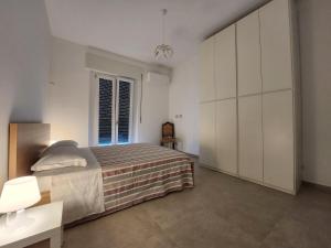 Postel nebo postele na pokoji v ubytování Aurora Rooms - Affitti Brevi Italia
