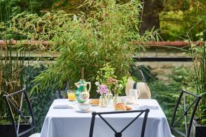 a white table with croissants and a vase on it at Maison Barnes Paris Trocadero in Paris +113 photos