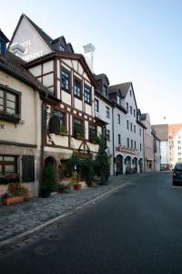 a row of buildings on a city street at Hotel am Jakobsmarkt in Nuremberg