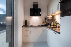 Kuchyň nebo kuchyňský kout v ubytování Felsenkeller Appartements