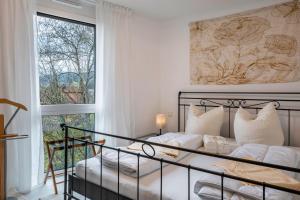 Postel nebo postele na pokoji v ubytování Felsenkeller Appartements