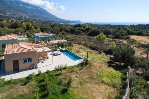an aerial view of a villa with a swimming pool at Villa Ioanna Mentoros in Kefallonia