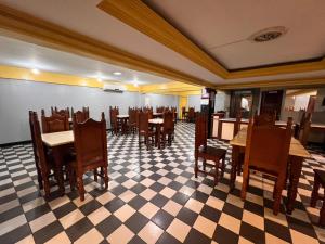 a dining room with tables and chairs in a restaurant at HOTEL CENTRAL - Belem in Belém