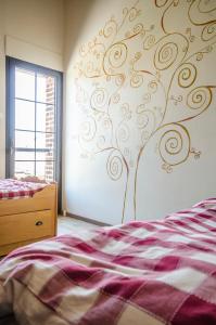 Ein Bett oder Betten in einem Zimmer der Unterkunft Fleur de Ciel