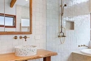 a bathroom with a shower and a sink at LUXE POINT in Blairgowrie
