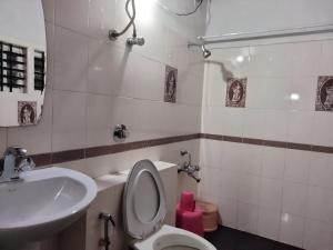 Koupelna v ubytování Prashanth Family Homestay