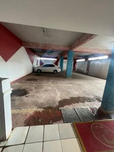 a car parked in an empty parking garage at Caribe Palace Hotel Samambaia Sul in Brasilia