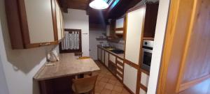 Køkken eller tekøkken på Mansarda nelle Dolomiti