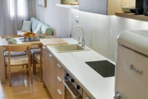 a kitchen with a sink and a counter top at Leo Apartment 2 bdr apt overlooking the harbor in Chania