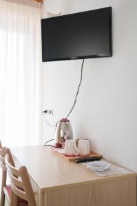TV a/nebo společenská místnost v ubytování Garnì Mariolina
