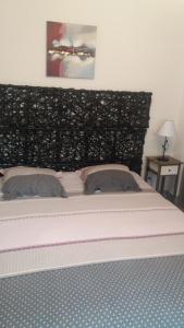 Postel nebo postele na pokoji v ubytování Gîtes Macarien