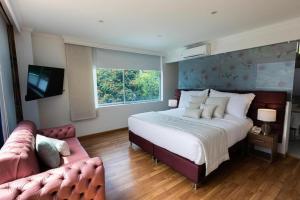 Postel nebo postele na pokoji v ubytování Libertg Hotels Spa Medellin