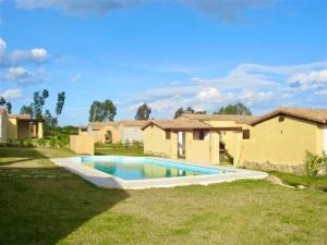 a swimming pool in the yard of a house at Villas with shared pool in Costa Rei just 500 meters from the sea in Costa Rei +22 photos