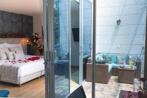 Postel nebo postele na pokoji v ubytování Libertg Hotels Spa Medellin