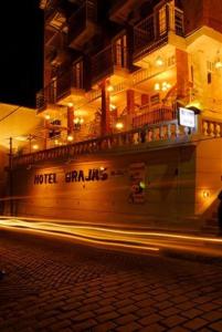 a building with lights on the side of a street at Hotel Brajas in Antananarivo