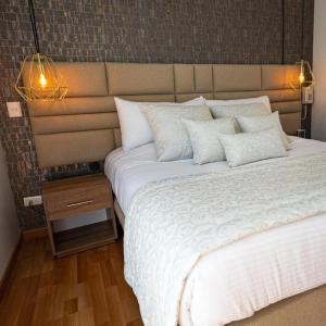 Postel nebo postele na pokoji v ubytování Libertg Hotels Spa Medellin