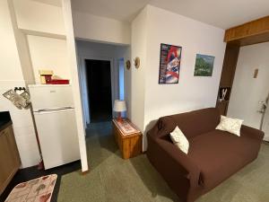 a living room with a couch and a refrigerator at Home Beta in Terminillo