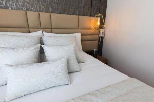 Postel nebo postele na pokoji v ubytování Libertg Hotels Spa Medellin