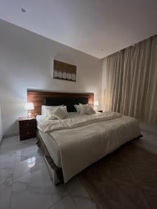 Ένα ή περισσότερα κρεβάτια σε δωμάτιο στο مسكن ترف 1