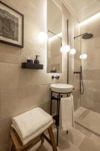 a bathroom with a sink and a shower at casa Olympia in Polignano a Mare